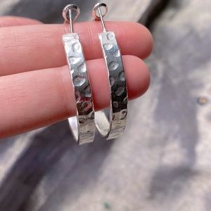 Silver tone textured hoop earrings